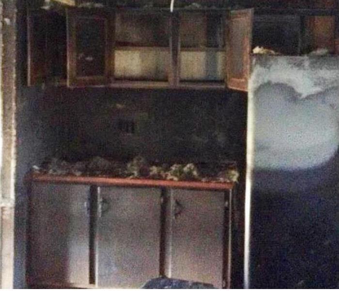 family room damaged by a fire covered in soot and smoke damage